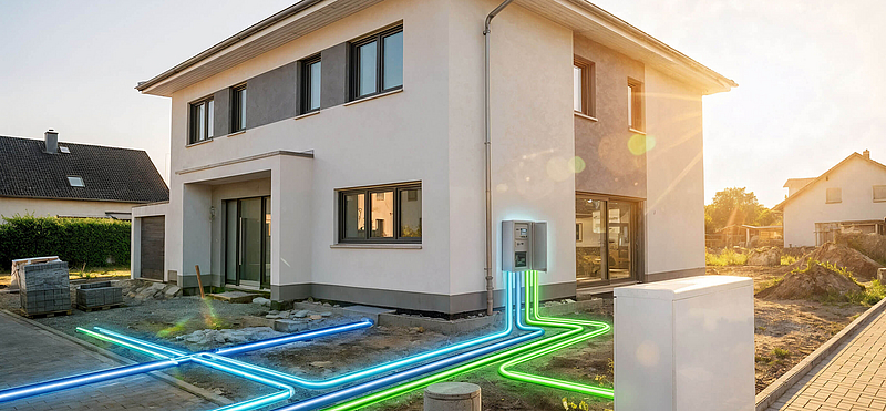 Neubau mit Hausanschlusskasten und im Boden verlegten Versorgungsleitungen